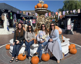 Committee members with pumpkins