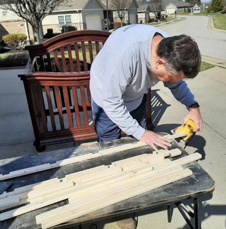 mark restoring a piece of furniture