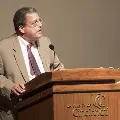man speaking at podium