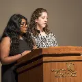 Two women at Podium