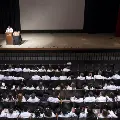 speaker in spotlight at ceremony