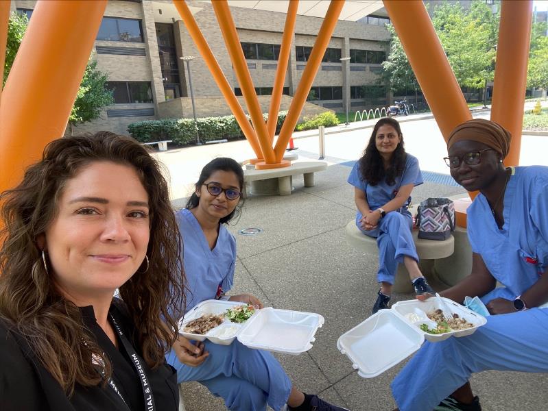 Four ladies eating lunch outside on Food Truck Day