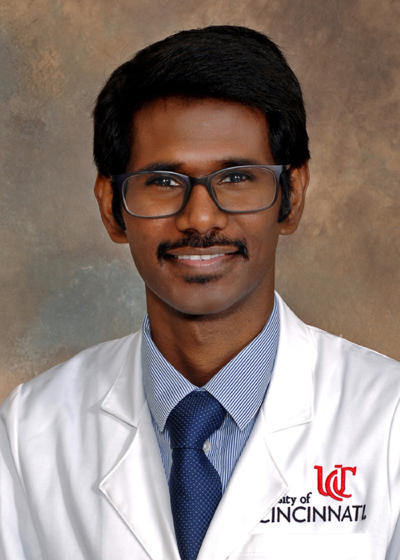 Photo of Karthickeyan  Chella Krishnan with UC lab coat